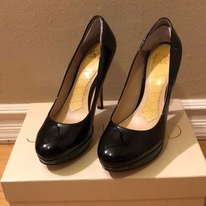 Joan and David black platform pumps